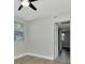 A cozy bedroom features a ceiling fan and plenty of natural light from the window at 243 45Th N St, St Petersburg, FL 33713