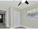 Bedroom featuring a ceiling fan, a window and a closet at 243 45Th N St, St Petersburg, FL 33713