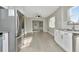 Modern kitchen with stainless steel appliances and sleek, light-colored flooring at 243 45Th N St, St Petersburg, FL 33713