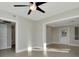 Bright living room with view of backyard and modern ceiling fan at 243 45Th N St, St Petersburg, FL 33713