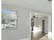 Bright living room with view of backyard and modern ceiling fan at 243 45Th N St, St Petersburg, FL 33713