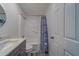 Bathroom with shower/tub combination, single sink vanity, and white fixtures at 2700 Bayshore Blvd # 588, Dunedin, FL 34698