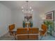 Bright dining room featuring a modern chandelier and glass table, perfect for entertaining at 2700 Bayshore Blvd # 588, Dunedin, FL 34698