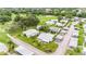 Aerial view of cozy neighborhood featuring mature landscaping, sidewalks, and well-maintained homes at 301 Andover S Pl # 175, Sun City Center, FL 33573