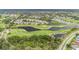 Aerial shot of a community with lakes and a golf course at 301 Andover S Pl # 175, Sun City Center, FL 33573