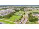 Wide aerial shot capturing the community's beautiful grounds, multiple amenities, and landscaping at 301 Andover S Pl # 175, Sun City Center, FL 33573