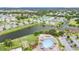 Aerial view of a neighborhood community with access to a pool and lake at 301 Andover S Pl # 175, Sun City Center, FL 33573