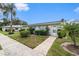 Charming single-story condo with well-manicured landscaping and a welcoming entrance at 301 Andover S Pl # 175, Sun City Center, FL 33573