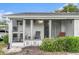 Home exterior featuring screened in lanai with seating and decorative exterior at 301 Andover S Pl # 175, Sun City Center, FL 33573
