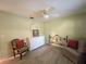 Light-filled bedroom with ceiling fan, neutral walls, and furnishings at 3509 Oak Lake Dr, Palm Harbor, FL 34684