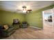 Bonus room offers flexible space with hardwood floors, ceiling fan and natural light at 3509 Oak Lake Dr, Palm Harbor, FL 34684