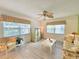 Cozy living room features light, neutral walls and floors, a ceiling fan and lots of natural light at 3509 Oak Lake Dr, Palm Harbor, FL 34684