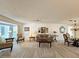 Spacious living room featuring stylish furniture, art pieces, and bay window at 3509 Oak Lake Dr, Palm Harbor, FL 34684