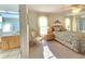 This main bedroom has neutral carpeting, natural light and ensuite bathroom access at 3509 Oak Lake Dr, Palm Harbor, FL 34684
