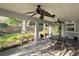 Sun-drenched patio with dining table and chairs overlooking the serene backyard at 3509 Oak Lake Dr, Palm Harbor, FL 34684
