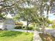 Picturesque street view showcasing well-maintained homes with lush landscaping and mature trees at 3509 Oak Lake Dr, Palm Harbor, FL 34684