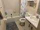 Modest bathroom featuring a shower-tub combo with a blue-and-grey bird-themed shower curtain at 3512 16Th E St, Bradenton, FL 34208