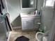 Bathroom showing light gray vanity cabinet, mirror, and toilet at 3512 16Th E St, Bradenton, FL 34208