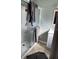 Ensuite bathroom features glass enclosed shower and neutral gray vanity at 3512 16Th E St, Bradenton, FL 34208