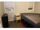 Bedroom features two windows, hardwood floors, neutral walls, and a simple setup at 3512 16Th E St, Bradenton, FL 34208