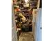 View of the home's pantry overflowing with contents at 3512 16Th E St, Bradenton, FL 34208