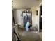 Modest room featuring a stainless steel refrigerator and a dart board on the wall at 3512 16Th E St, Bradenton, FL 34208