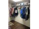 Walk-in closet featuring wire shelving, hanging clothes and overhead storage bins at 3512 16Th E St, Bradenton, FL 34208