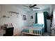 Comfortable bedroom featuring a bed, desk, and decorative items at 36439 Garden Wall Way, Zephyrhills, FL 33541