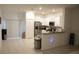 Bright kitchen features stainless steel appliances at 36439 Garden Wall Way, Zephyrhills, FL 33541