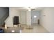 Open-concept living room features tile flooring and a ceiling fan at 36439 Garden Wall Way, Zephyrhills, FL 33541