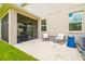 Back patio with comfortable seating, offers a cozy outdoor space for relaxation and entertaining at 4177 Beeswax Ln, Land O Lakes, FL 34638