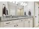 Bright bathroom features granite counters, dual sinks, and white cabinets, offering a clean, modern aesthetic at 4177 Beeswax Ln, Land O Lakes, FL 34638