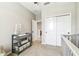 Functional Bedroom featuring a changing table with storage and a view into the hallway with closet at 4177 Beeswax Ln, Land O Lakes, FL 34638