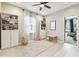 Bright, neutral bedroom featuring built-in bookshelves and light-colored wood floors with ample natural light at 4177 Beeswax Ln, Land O Lakes, FL 34638