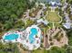 Aerial view of community featuring pool, playground and park at the Bexley community at 4177 Beeswax Ln, Land O Lakes, FL 34638