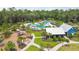 Aerial view of the Bexley Club community pool, splash pad, playground and green space at 4177 Beeswax Ln, Land O Lakes, FL 34638