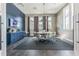 Well-lit conference room with a large table, modern decor, and wall-mounted TV at 4177 Beeswax Ln, Land O Lakes, FL 34638