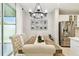 Farmhouse dining room boasts a modern chandelier, ample seating and natural light at 4177 Beeswax Ln, Land O Lakes, FL 34638