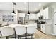 Bright kitchen boasts a center island with quartz countertops, stainless steel appliances, and pendant lighting at 4177 Beeswax Ln, Land O Lakes, FL 34638