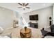 Bright living room with wood floors, comfortable seating, and modern decor creating a welcoming and functional living space at 4177 Beeswax Ln, Land O Lakes, FL 34638