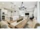 Bright open-concept living space features a kitchen, dining room, and living area with lots of natural light at 4177 Beeswax Ln, Land O Lakes, FL 34638