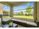 Inviting screened patio furnished with cozy seating, ideal for relaxing and enjoying the outdoor view at 4177 Beeswax Ln, Land O Lakes, FL 34638