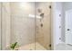 Step into a beautifully tiled shower with glass door and walls offering natural light to brighten the room at 4177 Beeswax Ln, Land O Lakes, FL 34638