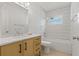Bathroom boasts a vanity with sleek fixtures and shower with subway tile surround at 433 Pineapple St, Tarpon Springs, FL 34689