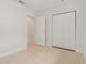 The bedroom has ample closet space, and an open doorway to another room in the house at 433 Pineapple St, Tarpon Springs, FL 34689