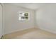 The bedroom features a window that provides natural light and views of the surroundings at 433 Pineapple St, Tarpon Springs, FL 34689