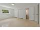 The bedroom features a closet, bathroom access, and a window with natural light streaming in at 433 Pineapple St, Tarpon Springs, FL 34689