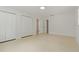 Spacious bedroom with two closets and a convenient attached bathroom with neutral color palette at 433 Pineapple St, Tarpon Springs, FL 34689