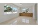 Bright dining area with large windows, offering plenty of natural light and space for entertaining at 433 Pineapple St, Tarpon Springs, FL 34689