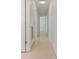Bright hallway with multiple doors and neutral walls and flooring, offering access to various rooms at 433 Pineapple St, Tarpon Springs, FL 34689